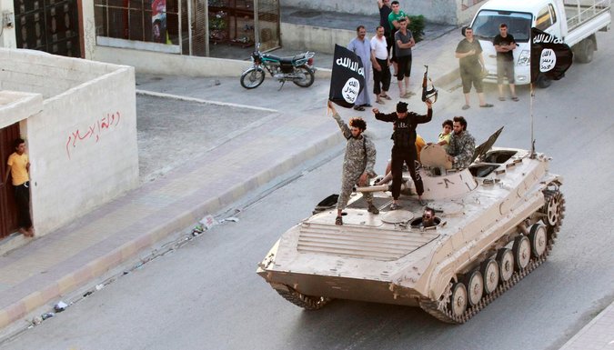 Islamic State fighters paraded along the streets of Raqqa, Syri