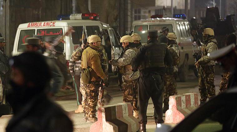 Afghan security forces stand guard near a terrorist attack site, close to the Spanish embassy, in the center of Kabul, Afghanistan, Friday, Dec. 11, 2015. An Afghan official says a car bombing near a foreign guesthouse in central Kabul has wounded one person. (AP Photos/Massoud Hossain)