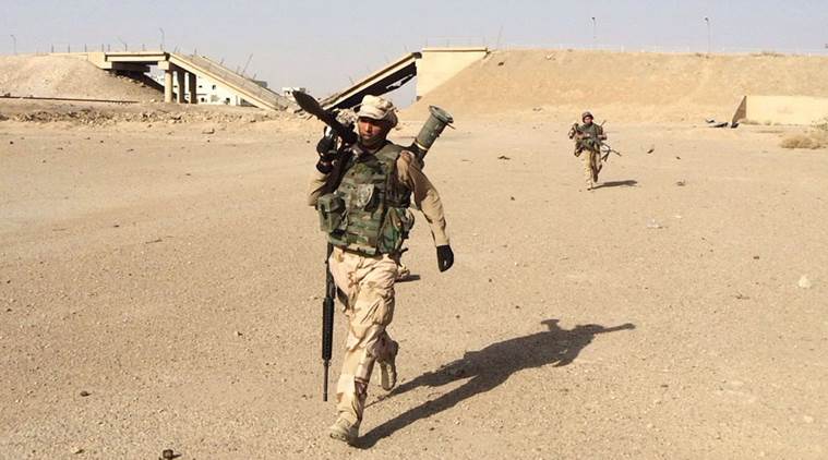 In this Friday, Oct. 16, 2015 photo, Iraqi security forces regain control of Tamim district in southern Ramadi. Security forces, backed by allied Sunni volunteer tribal fighters and supported by U.S.-led coalition airstrikes against Islamic State group advanced their position after clashes in southern Ramadi, the capital of Iraq's Anbar province, 70 miles (115 kilometers) west of Baghdad, Iraq. (AP Photo)